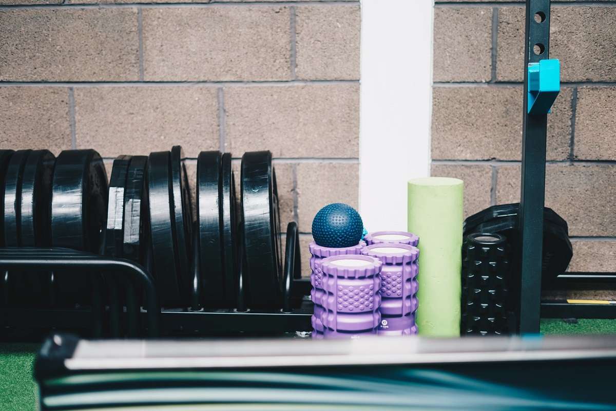 gym equipment placed near wall in a small home gym