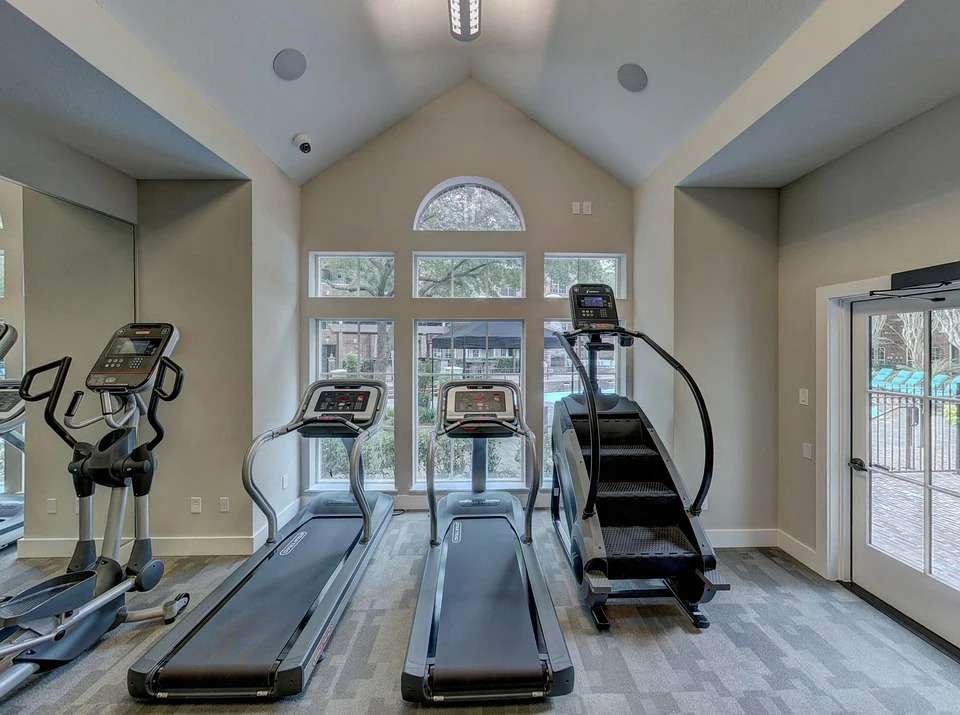 home workout gym machines on wooden floor